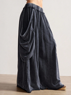 Dark gray wide-leg pants on a neutral background