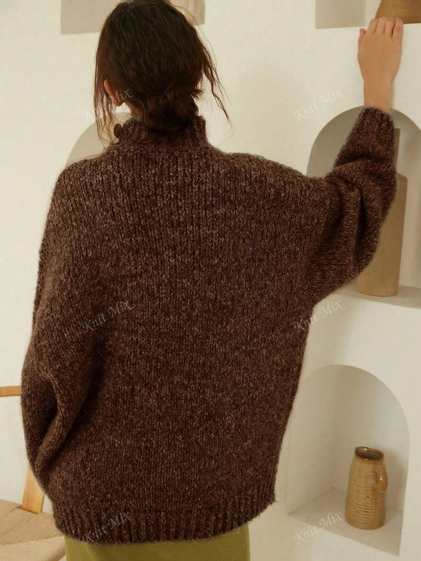 Person wearing a brown sweater in a minimal indoor setting