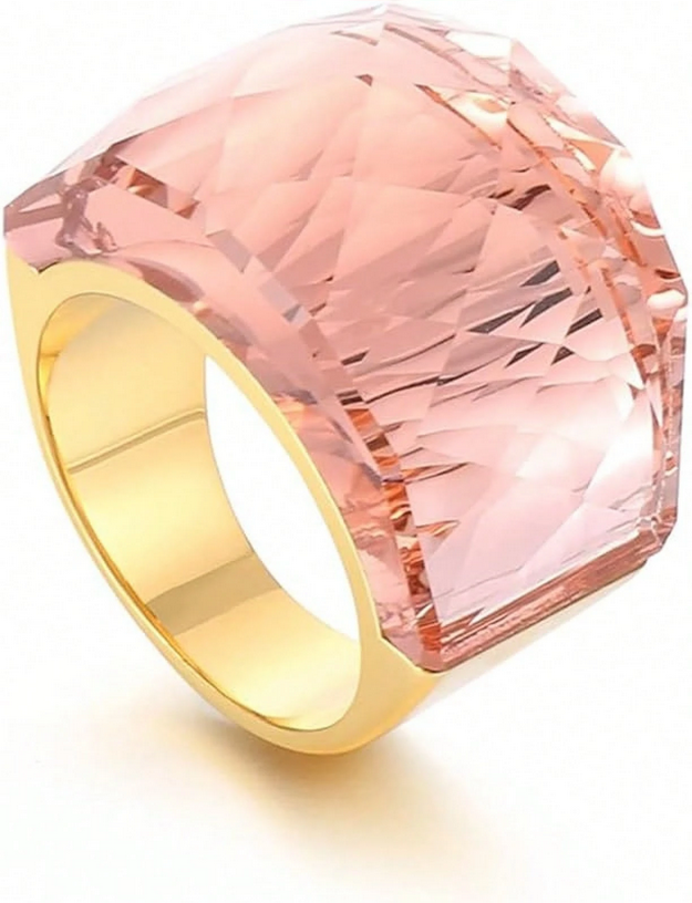 Ring with pink gemstone and gold band on a white background