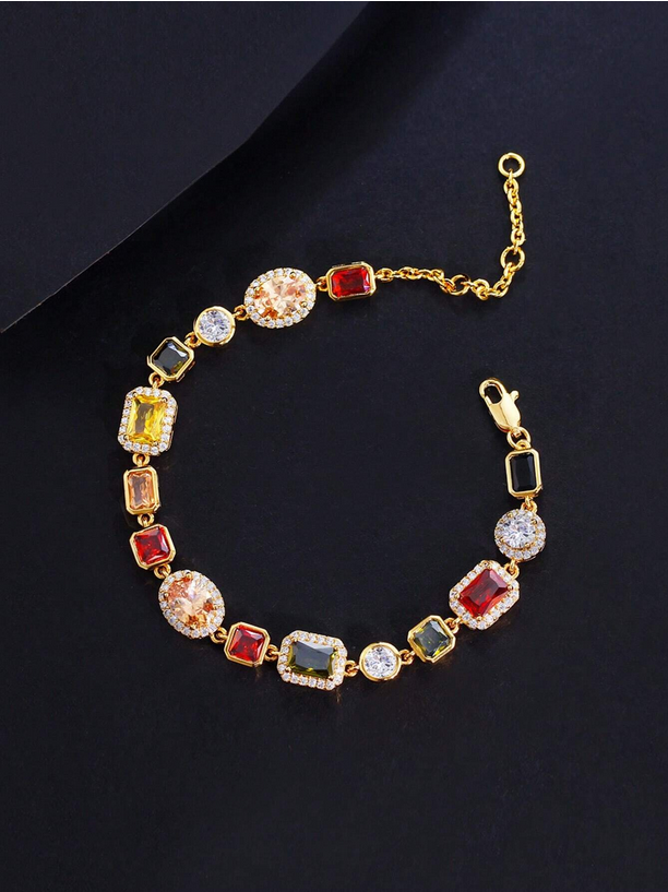 Gold bracelet with colorful gemstones on a dark background