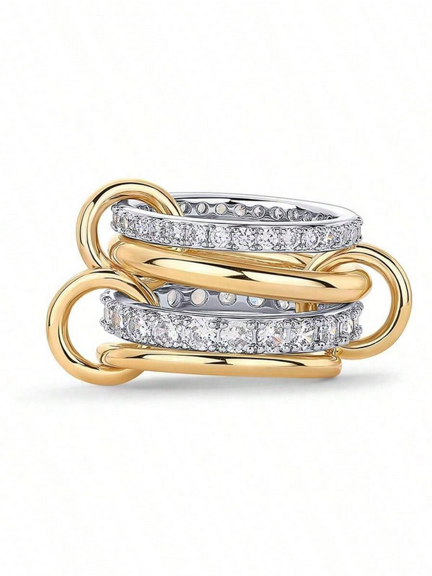 Three interlocking gold rings with diamond accents on a white background