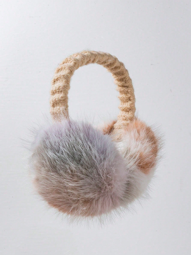 Pair of fur ear muffs on a light gray background