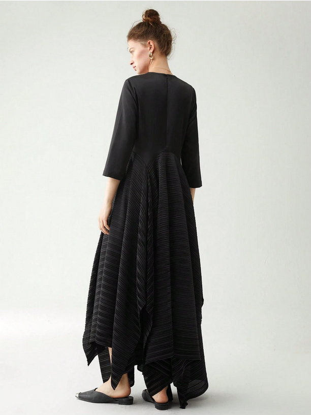 Woman wearing a black dress with a plain background