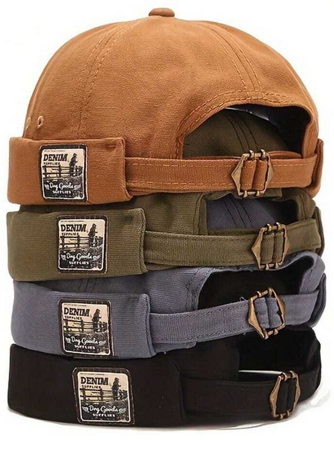 Stack of four denim caps in brown, green, gray, and black with visible brand labels.