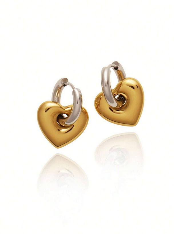 Heart-shaped gold earrings on a white background